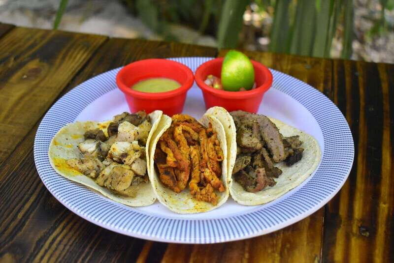 Cancún: Beachside Tacos & Town Tour with tequila tasing - Near the flea market: Maya tacos and cochinita pibil context