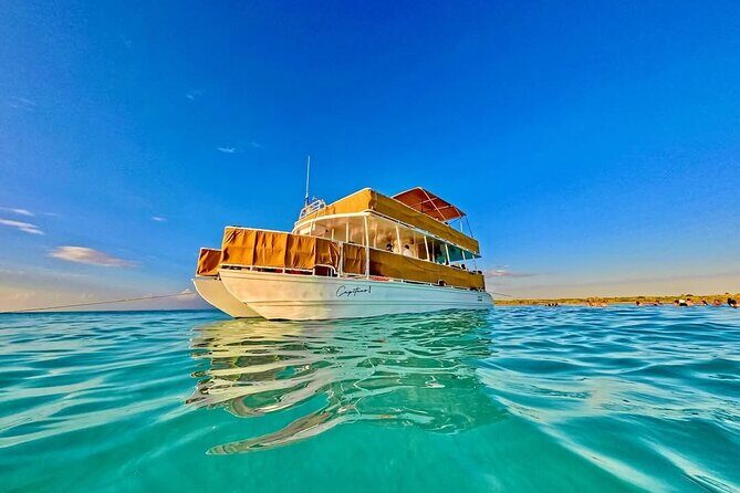 Cozumel Catamaran Tour: Snorkel at Top Reefs & Open Bar - Leaving San Miguel: Panoramic Water, Music, and the Open Bar Clock