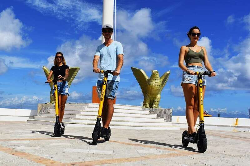 Cozumel: Clear Boat and Electric Scooter Ride - Downtown scooter ride on a designated lane: scenery without the stress