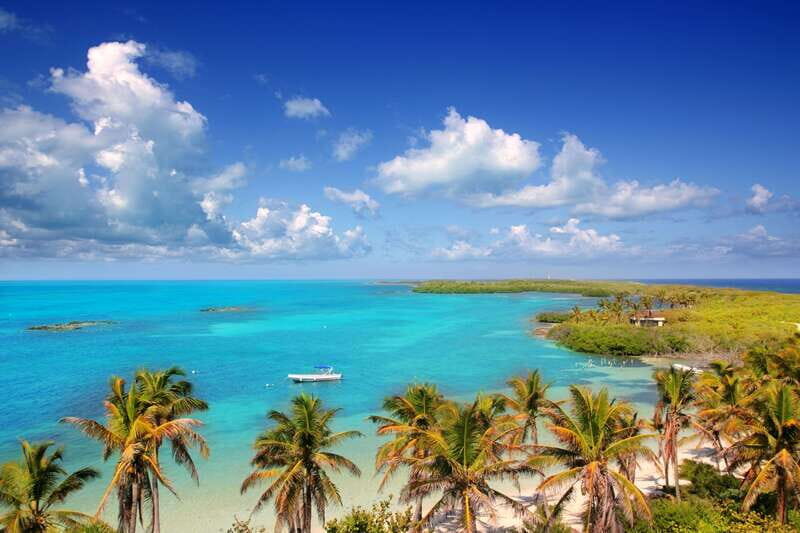 Full Day Nature Expedition to Contoy Island and Isla Mujeres - Getting There: AC Van, Multiple Pickup Stops, and Boat Time
