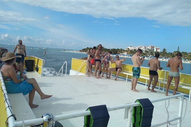 Isla Mujeres Catamaran Unlimited! Transportation from Playa del Carmen - The onboard vibe: unlimited open bar, music energy, and buffet lunch