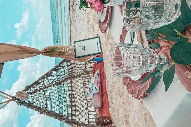 Luxury picnic on the beach - The food and drinks: charcuterie board, seasonal fruit, wine, and kombucha
