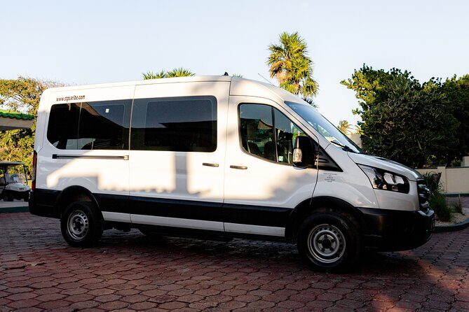Tulum Airport Transportation to your destiny in Private Minibus - Spotting Your Driver: Tablet Meet-Up, Shirt Colors, and the STP Caribe Logo