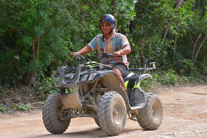Tulum's Thrilling Jungle: ATV, Zip Lines, Cenote & More! - Zip lines over the trees—and a water line for the brave